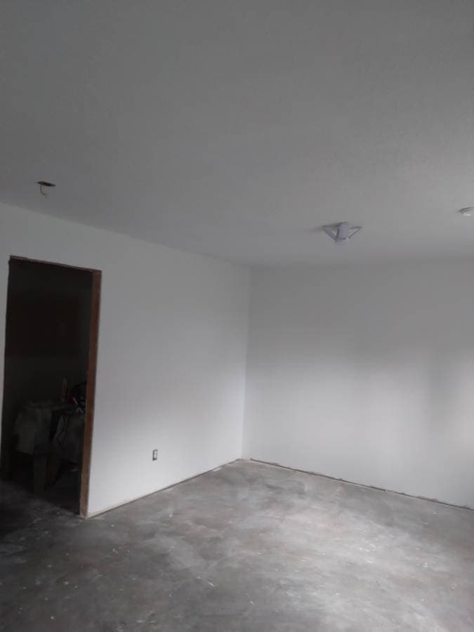 picture of a newly remodeled shower with glass walls and sliding glass doors